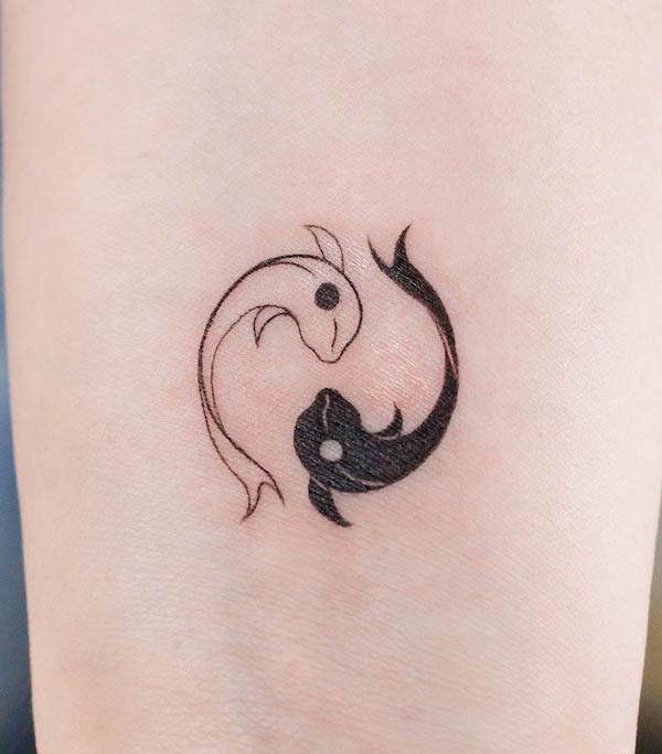 Minimalist yin yang fish tattoo by @aewan_tattoo