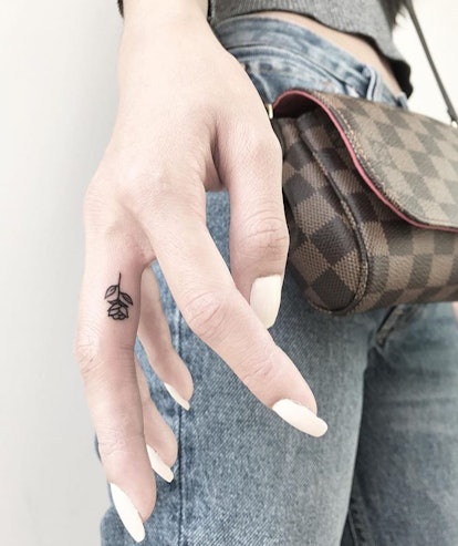 Hide a tattoo between your fingers.