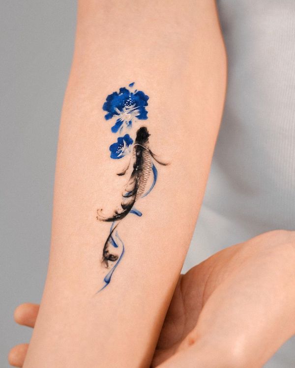 Elegant realism koi fish with flowers tattoo by @e.nal_.tattoo