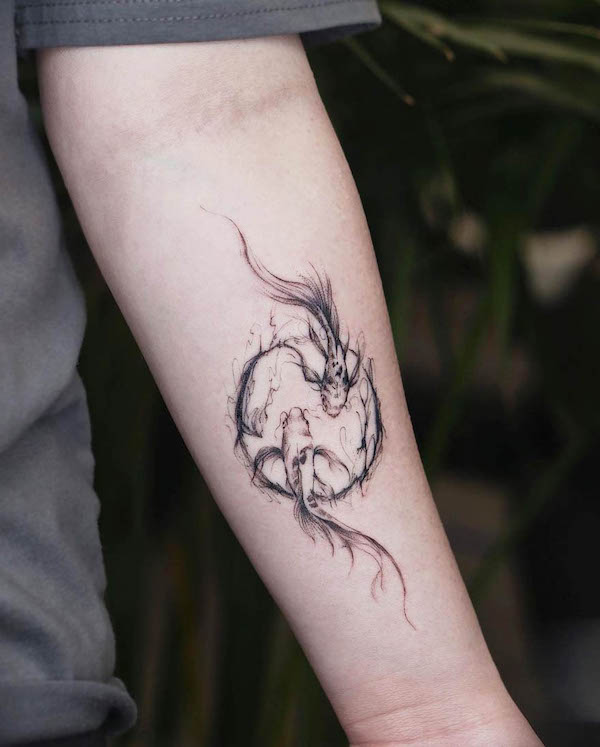 Koi fish and yin and yang circle tattoo by @vivi_tattooer