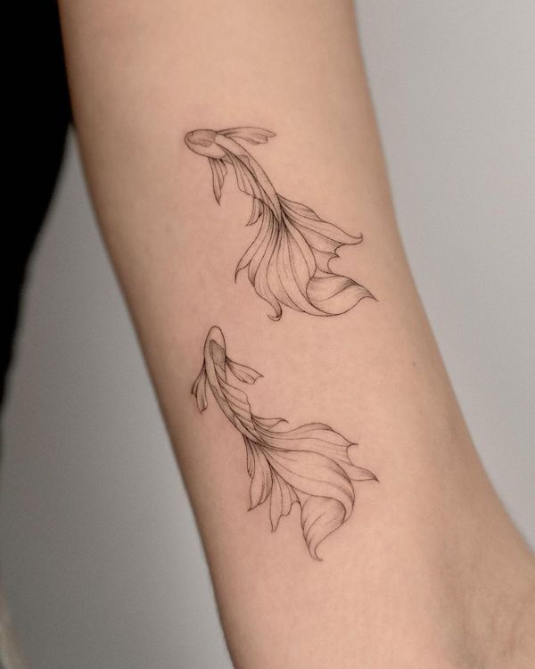 Elegant fine line koi fish tattoo by @maro_ink