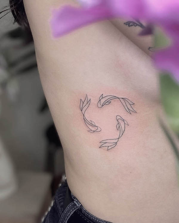 Simple small koi fish tattoo by @bellatattstudio