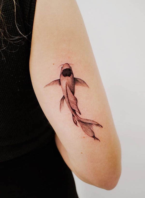 Simple black and grey koi fish tattoo by @monkeynoma_tattoo