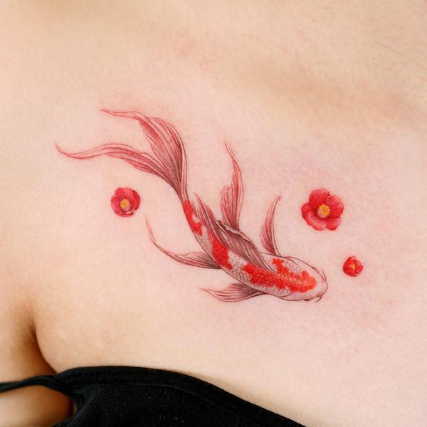 Realism red koi fish collarbone tattoo by @leeso_tattoo