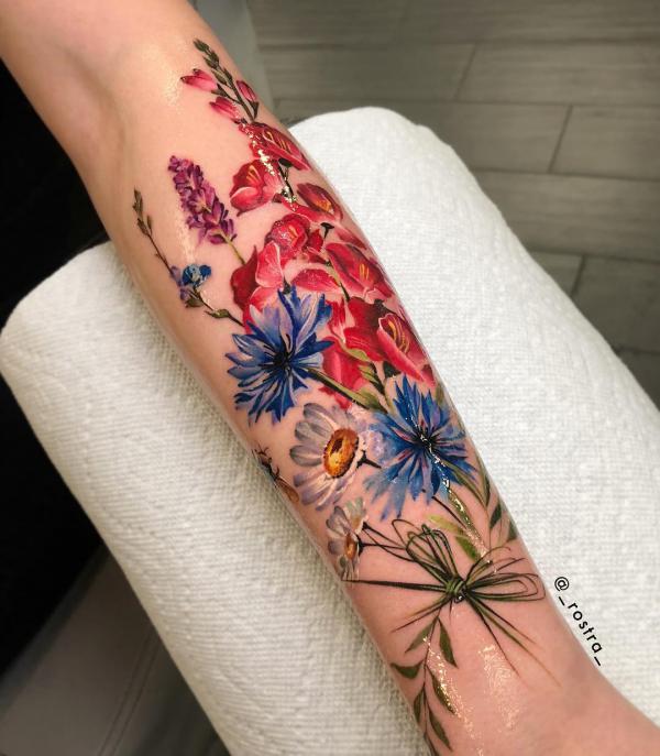 Cornflower and daisy tattoo