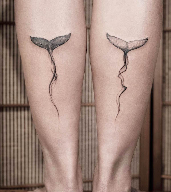 Matching whale tail tattoos on the calf by @ink.feb24