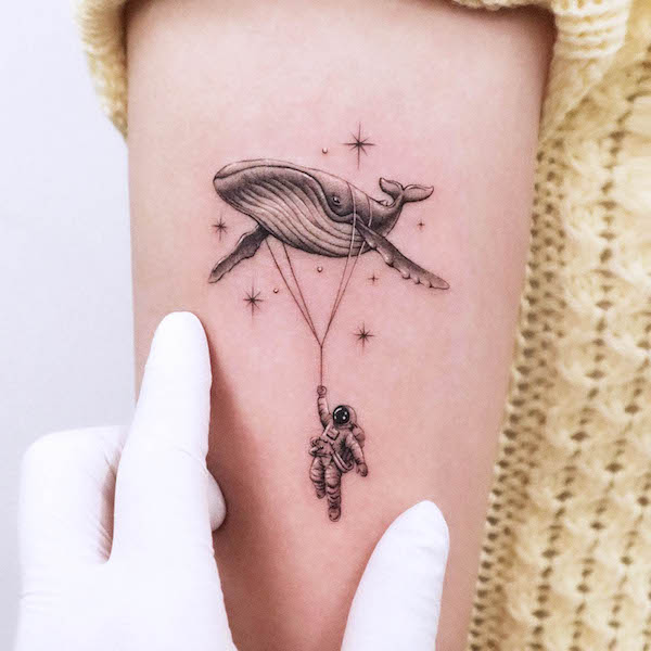 Whale and astronaut tattoo by @tattooist_jaeo