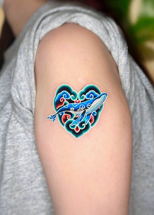 Striking whale and heart tattoo by @minhwa.tattooist
