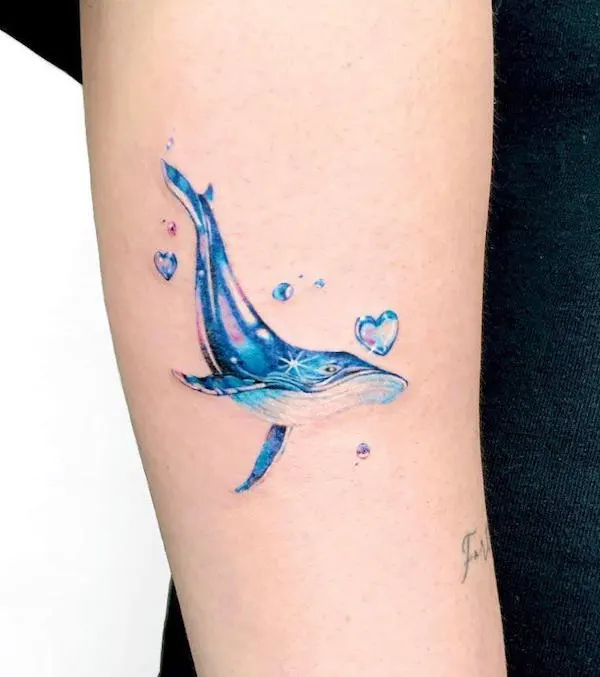 Iridescent whale by @sonnee_tattooist