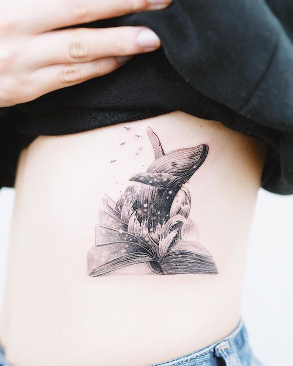 Book and whale tattoo by @nandotattooer