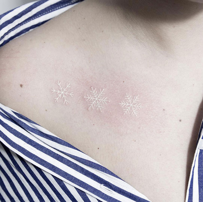 Delicate White Snowflake Tattoo