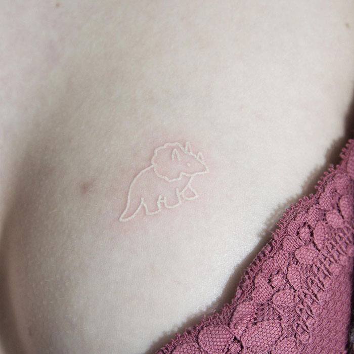 Cute White Ink Dinosaur Tattoo