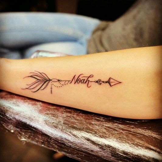 Arrow with baby name tattoo