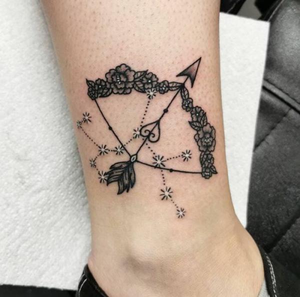 Black roses Sagittarius bow and arrow with constellation tattoo