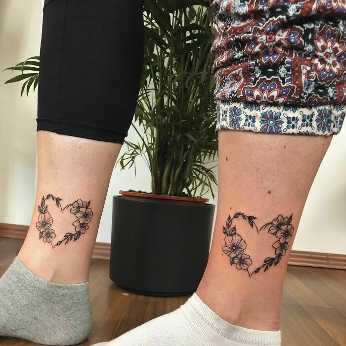 Heart made of flowers matching ankle tattoos