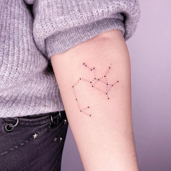 Sagittarius constellation tattoo on inner forearm