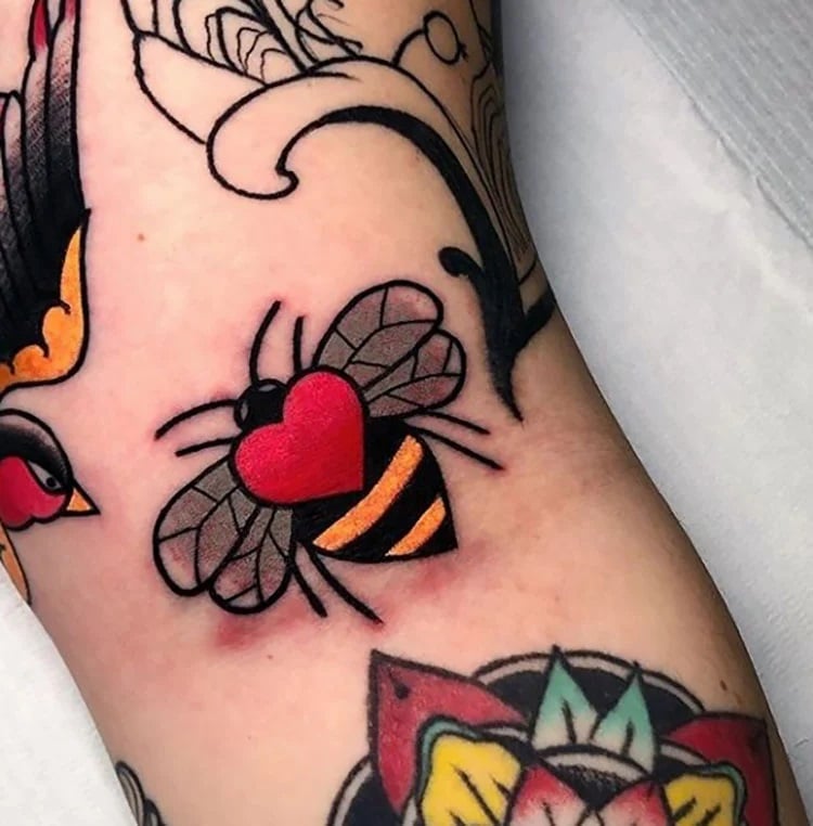 large bee with red heart