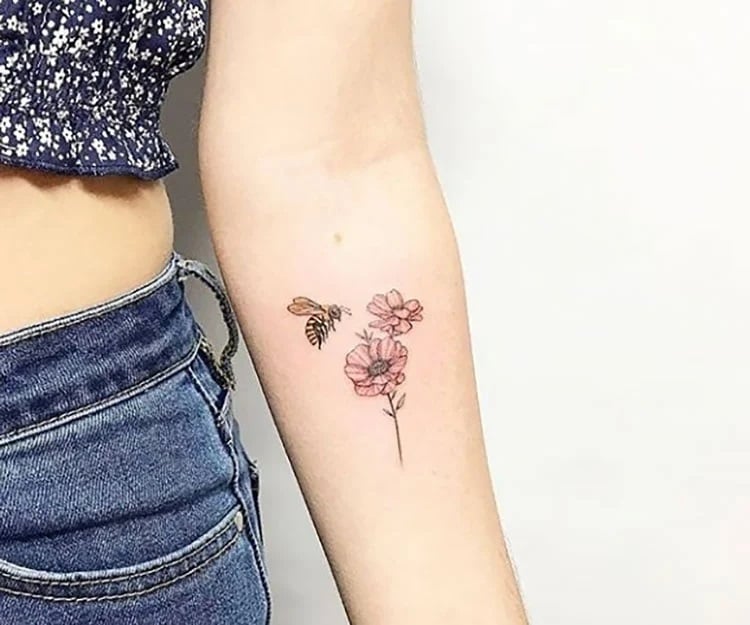 bee with flower on arm