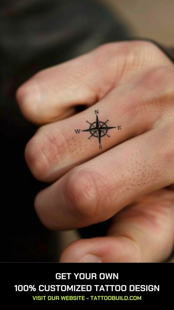 small compass tattoo  on the finger