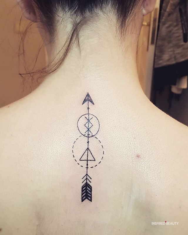 Arrow design back tattoo on woman