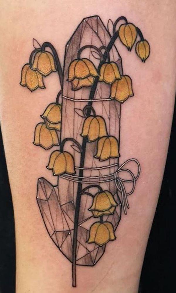 Crystal and yellow Lily of the valley tattoo