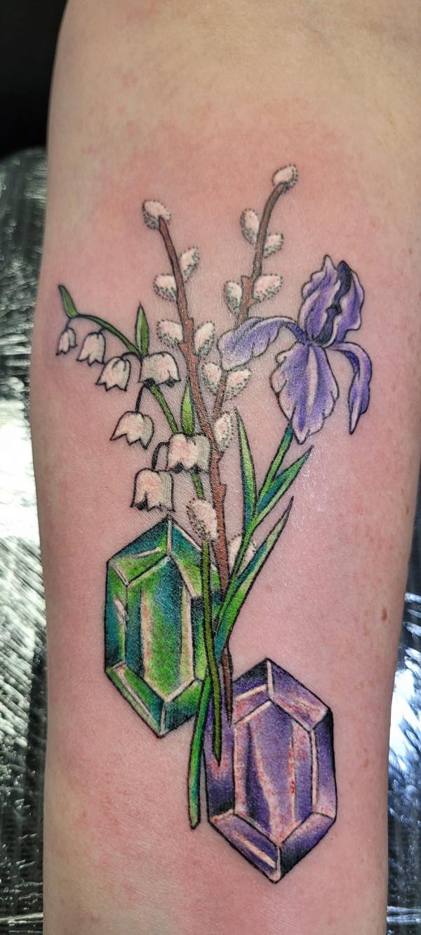 Crystal with iris and lily of the valley tattoo