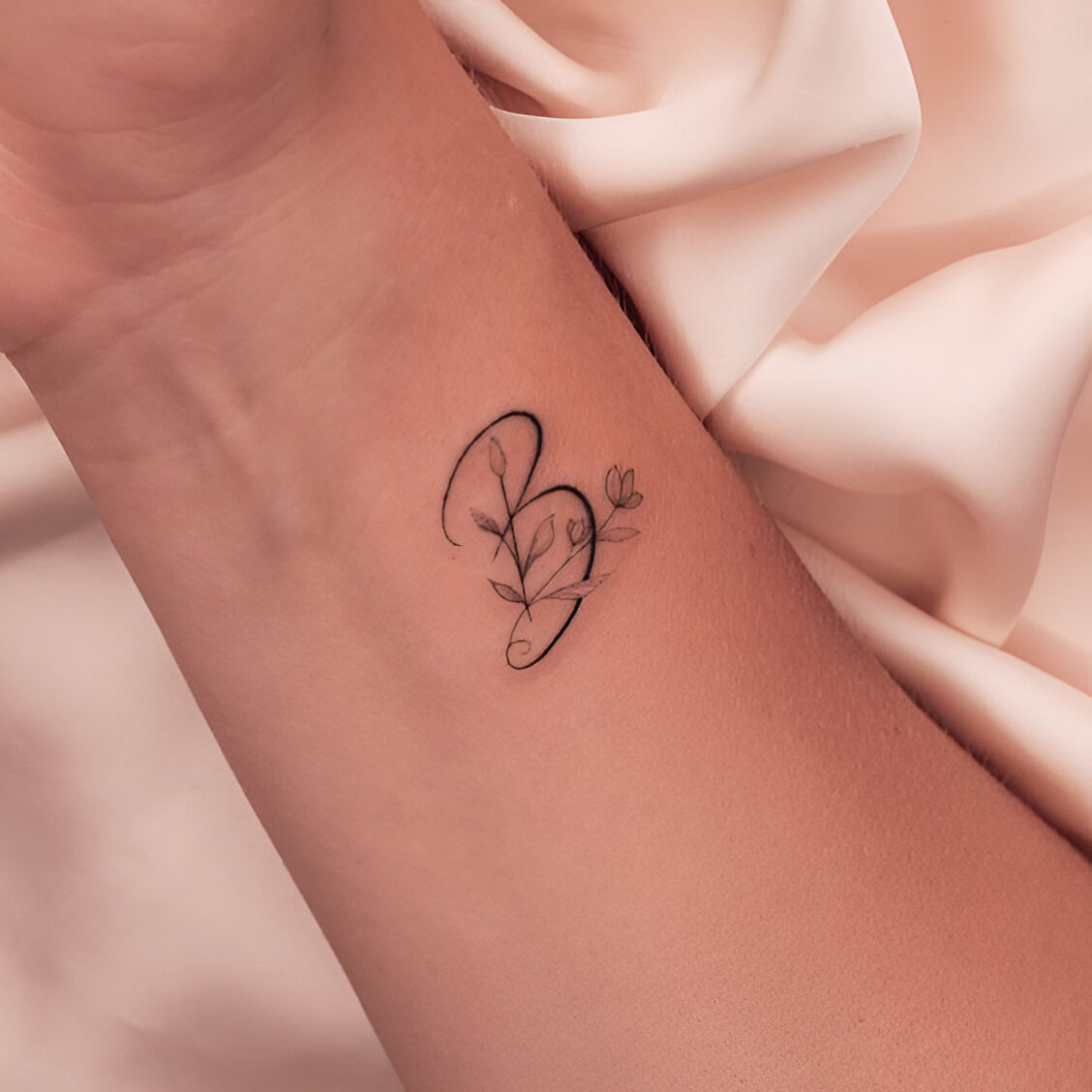 Elegant Floral Initial Tattoo