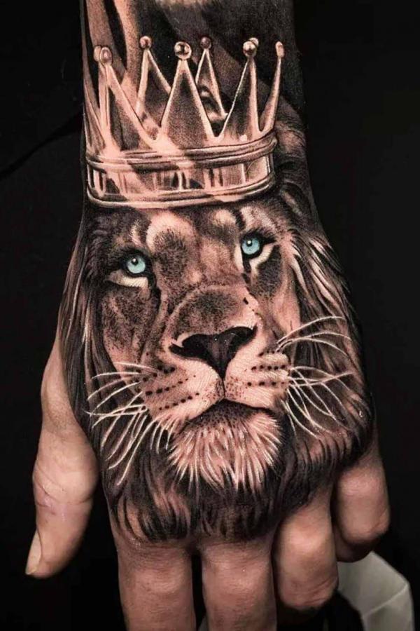 Hand Lion king with crown tattoo