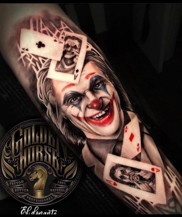 Joker with cards and words hahaha tattoo