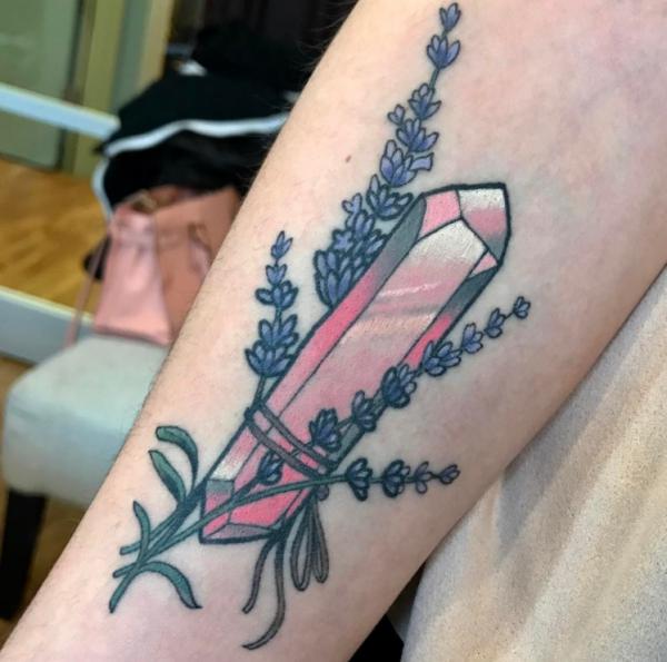 Lavender and crystal tattoo on forearm