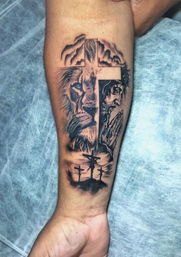 Lion cross and Jesus tattoo forearm