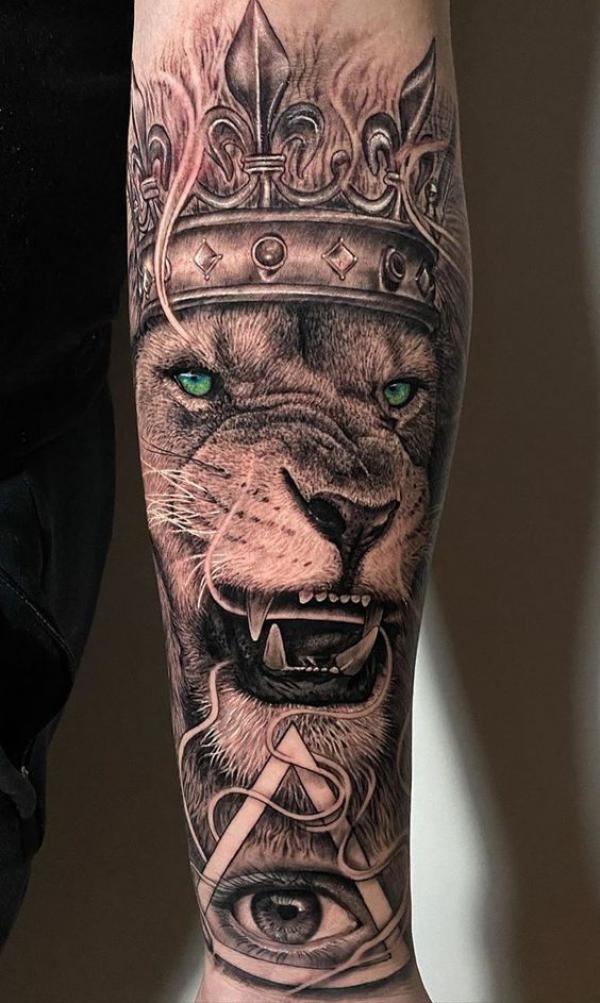 Lion king and all seeing eye tattoo forearm