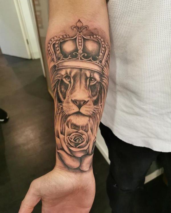 Lion king and rose forearn tattoo