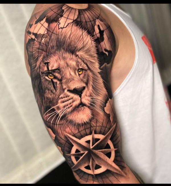 Lion king globe compass and cross tattoo