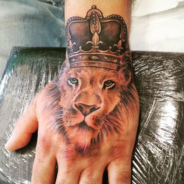 Lion king tattoo hand