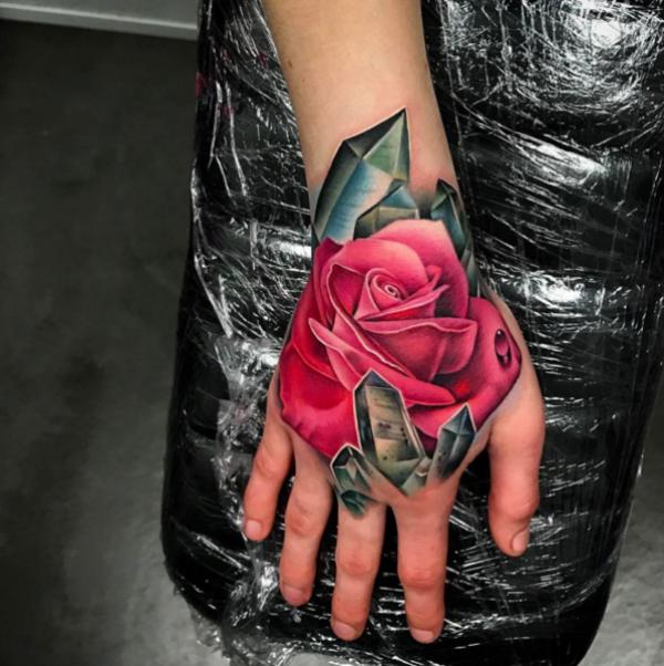 Red rose and crystal hand tattoo