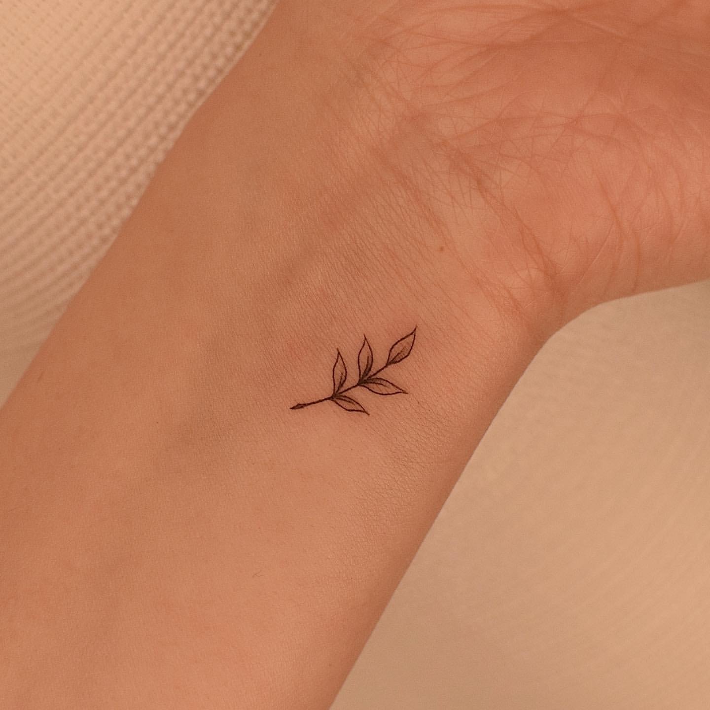 Simple Vine Wrist Tattoo