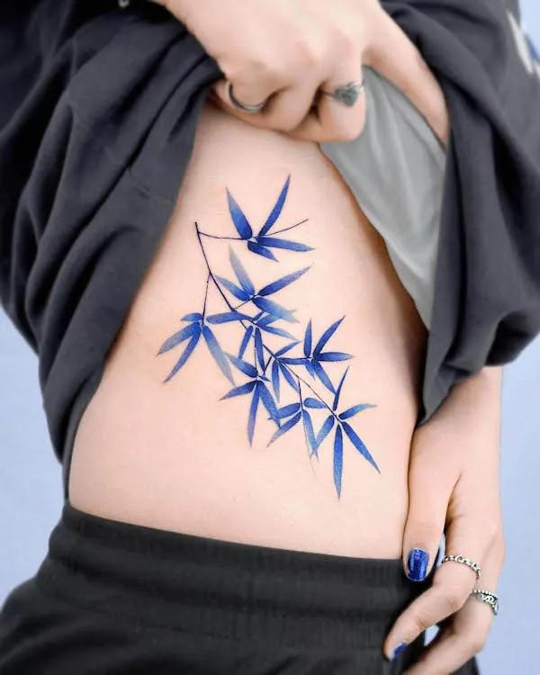 bamboo leaves side boob tattoo