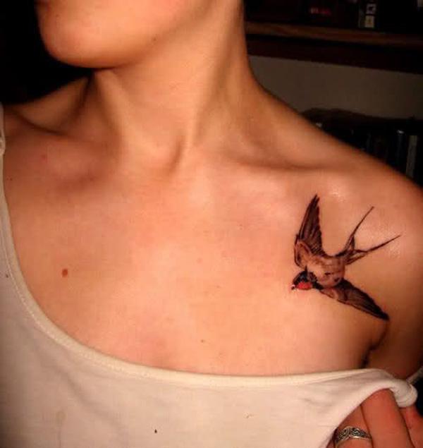 Clavicle swallow tattoo