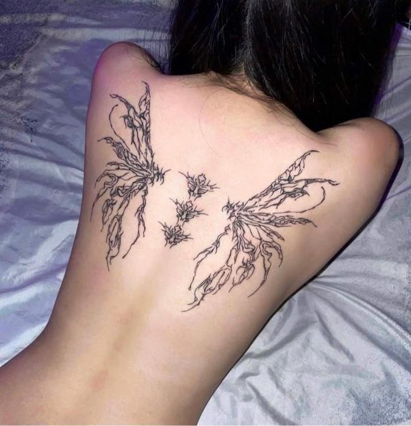 cyber sigilism angel wings tattoo on back