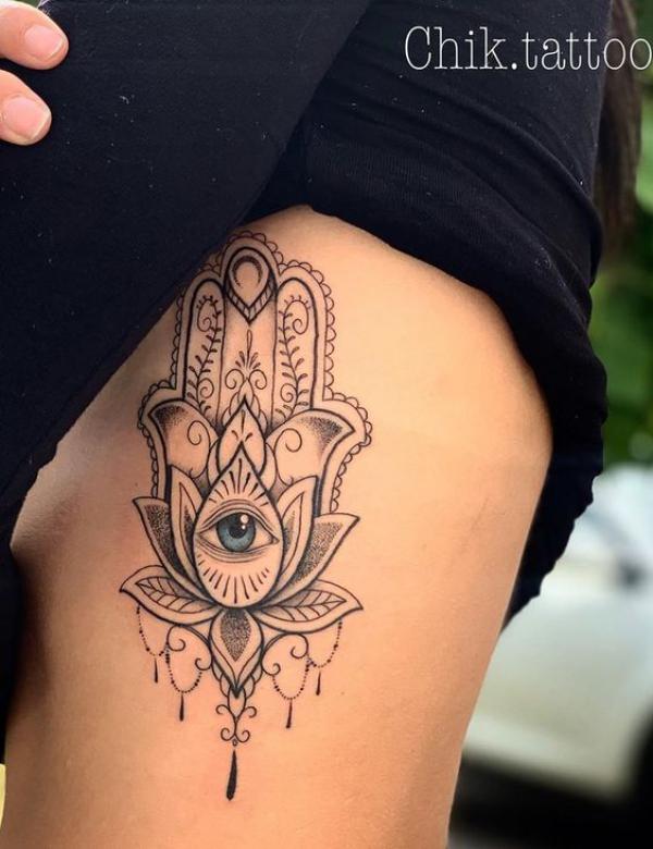 hamsa hand with eye side boob tattoo