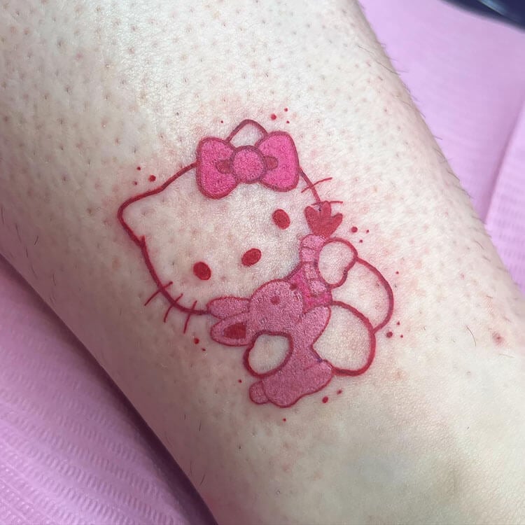 Hello Kitty Feeding a Rabbit