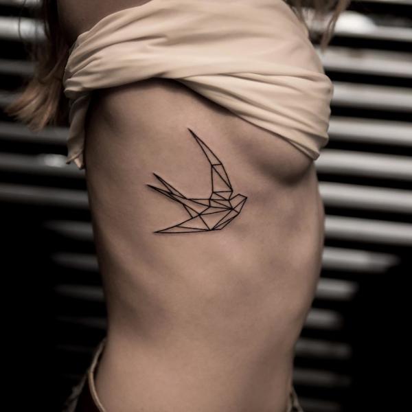 origami swallow side boob tattoo