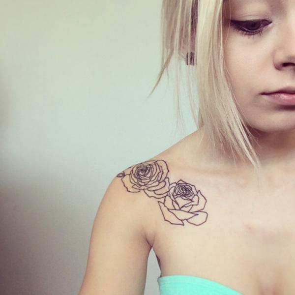 Rose outline collarbone tattoo