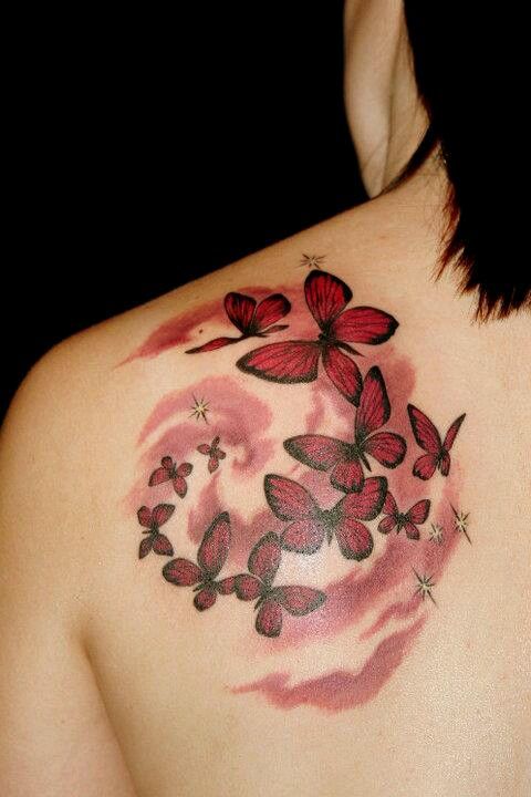 A flock of red butterfly shoulder blade tattoo