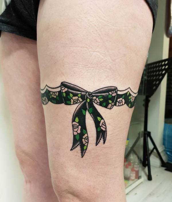 Bow Wraparound Tattoos On Thigh 5