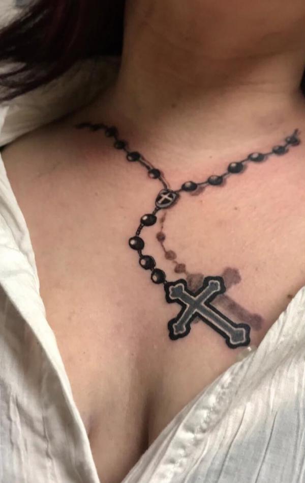 Cross necklace tattoo for women