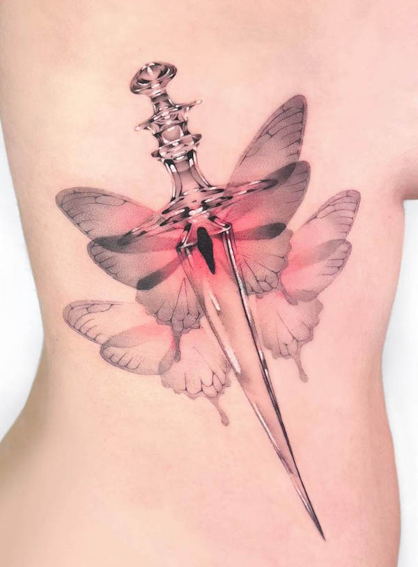 Crystal butterfly dagger tattoo by @arte.perdura