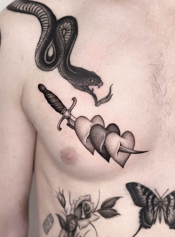 Dagger and heart chest tattoo by @breadloaf__