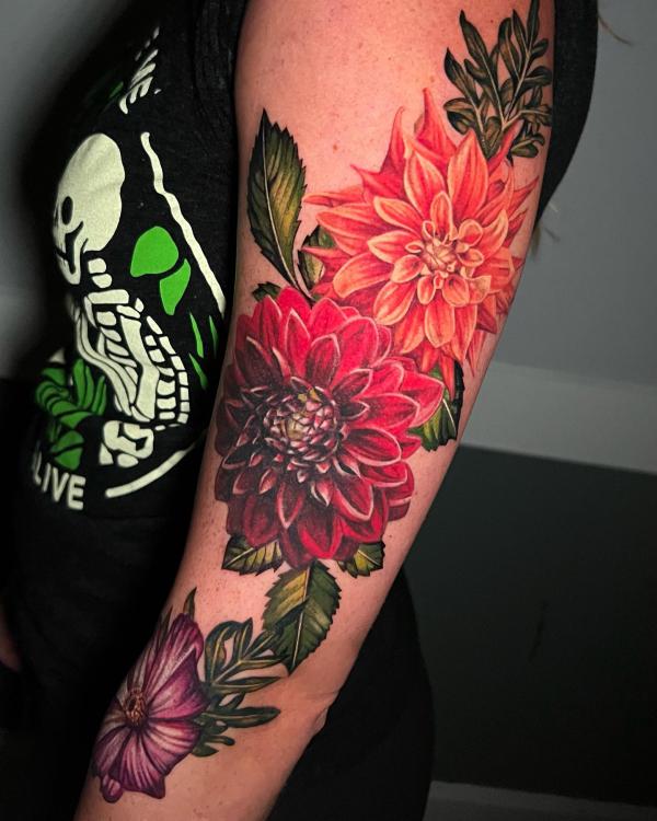 Dahlia flowers arm tattoo